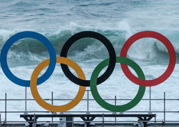 The Olympic rings are in place at the Beach Volleyball Arena on Copacabana Beach. Picture: AFP/Getty Images