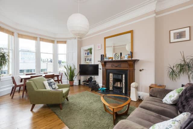 The bay-windowed sitting room is light and spacious.