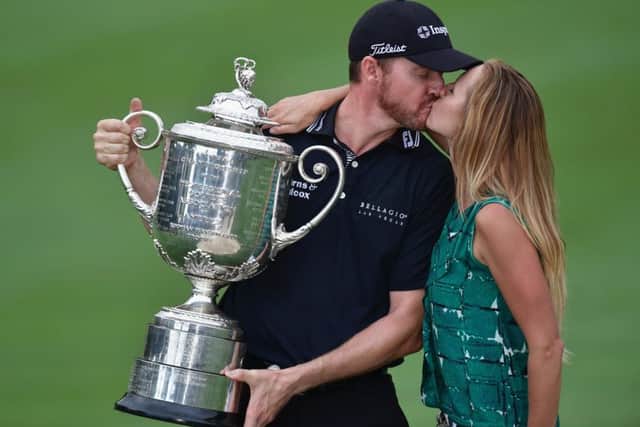 Walker kissing his wife Erin after winning the Wanamaker Trophy. Picture: Getty