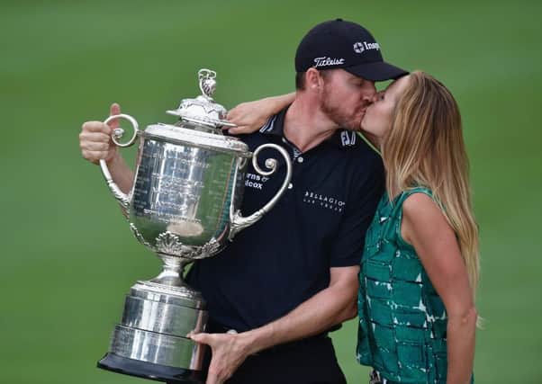 Walker kissing his wife Erin after winning the Wanamaker Trophy. Picture: Getty