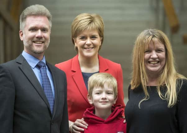 Nicola Sturgeon meeting Gregg and Kathryn Brain and their son Lachlan. Picture: PA