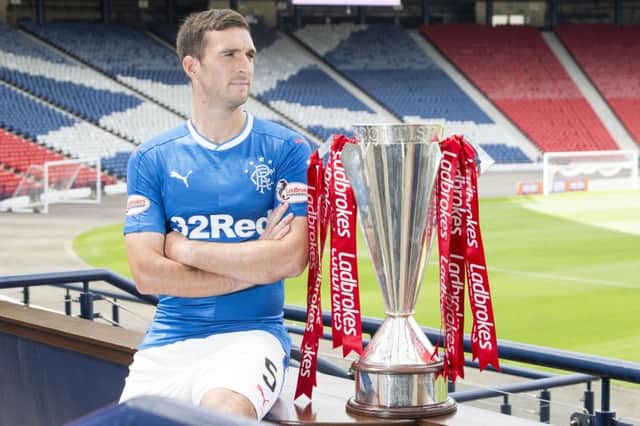 Lee Wallace with the Ladbrokes Premiership trophy. Picture: PA
