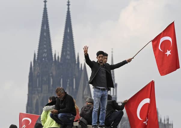 Thousands of supporters of Erdogan demonstrate in Cologne, Germany. Picture: AP