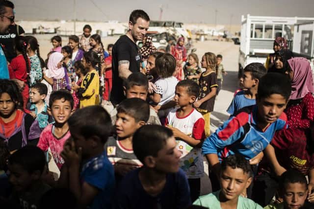 Ewan McGregor meets displaced children at the Debaga IDP camp in northern Iraq. Picture: PA