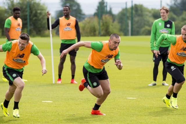 Celtic captain Scott Brown, centre, sprints with Callum McGregor, left, and Leigh Griffiths in training. Picture: SNS