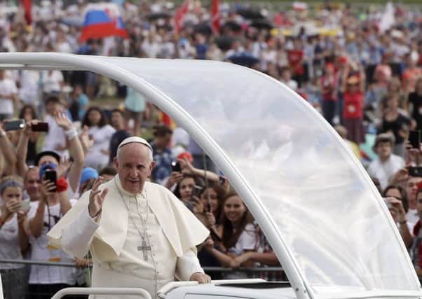 Pope Francis waves to crowds on a recent visit to Krakow. Picture: AP