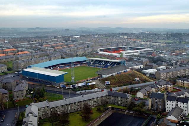 Dens Park with Tannadice Stadium in the background. Picture: SNS