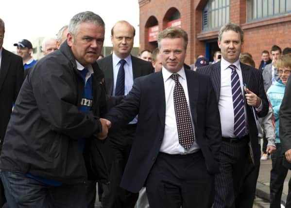 Craig Whyte is welcomed to Ibrox. The relationship with the fans quickly turned sour. Picture: SNS