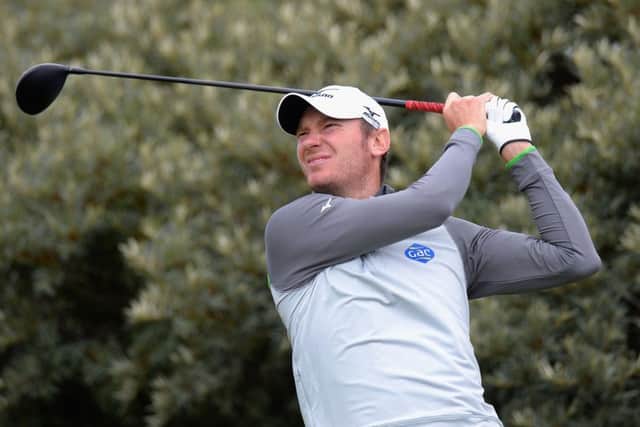Chris Wood plays his first shot on the 15th tee during the Paul Lawrie Matchplay Pro-Am at Archerfield Links. Picture:  Tony Marshall/Getty Images
