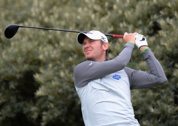 Chris Wood plays his first shot on the 15th tee during the Paul Lawrie Matchplay Pro-Am at Archerfield Links. Picture: Tony Marshall/Getty Images