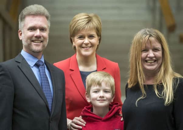 The Brains, pictured with Nicola Sturgeon, have been asked to leave the UK. Picture: PA