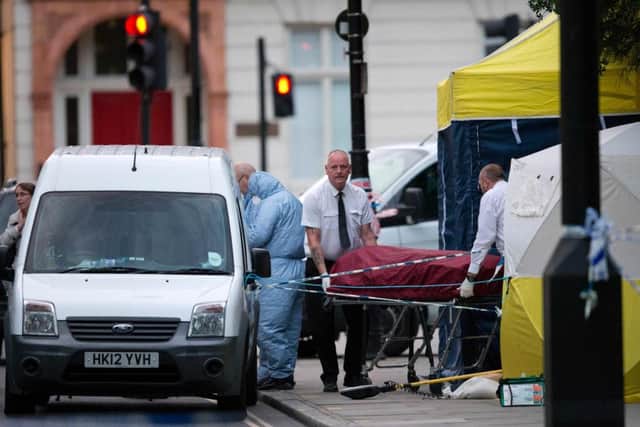 A body bag is removed from Russell Square. Picture: AFP/Getty Images
