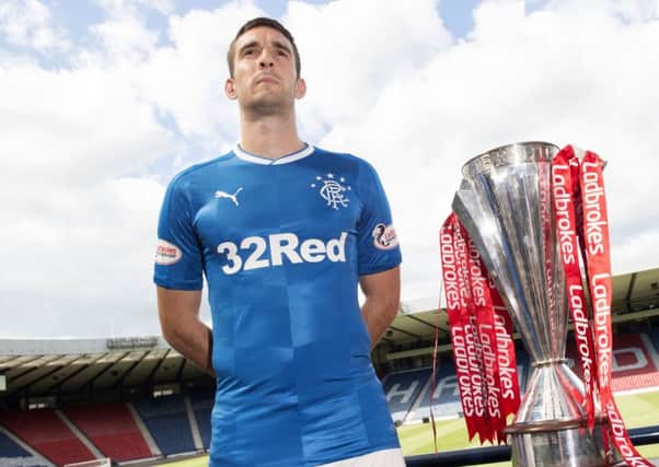 Lee Wallace with the new Rangers kit at Hampden on Monday. Picture: SNS