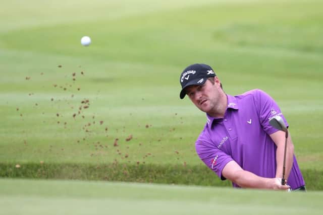 Marc Warren, a semi-finalist 12 months ago, splashes out of a bunker at Archerfield Links on his way to a first-round win in the Aberdeen Asset Management Paul Lawrie Match Play. Picture: Getty Images