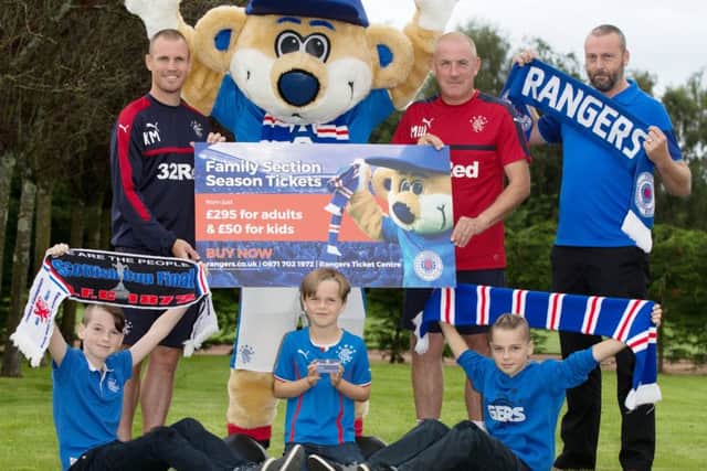 Kenny Miller, left, and manager Mark Warburton lend a hand promoting family season tickets. Picture: SNS