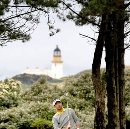 Fidra Island provides a spectacular backdrop as Eduorda De La Riva plays his second shot to the fifth at Archerfield Links. Picture: PA
