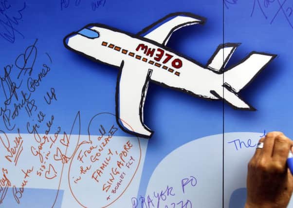 Malaysia has confirmed one of the pilots of Malaysia Airlines Flight 370 had plotted a course on his home flight simulator to the southern Indian Ocean, where the missing jet is believed to have crashed.
Picture: AP/Joshua Paul,