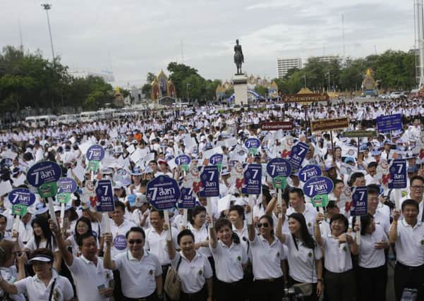 Government workers attend a rally to encourage people to vote in the upcoming referendum polling day in Bangkok, Thailand, on Sunday,
Picture : AP/Sakchai Lalit