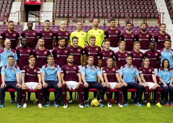 Hearts' players and staff pose for their team photo ahead of the new season. Picture: SNS