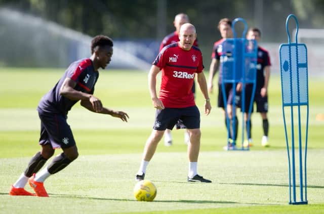 Manager Mark Warburton puts Joe Dodoo through his paces as Rangers prepare to face Hamilton Accies at Ibrox this lunchtime. Picture: SNS