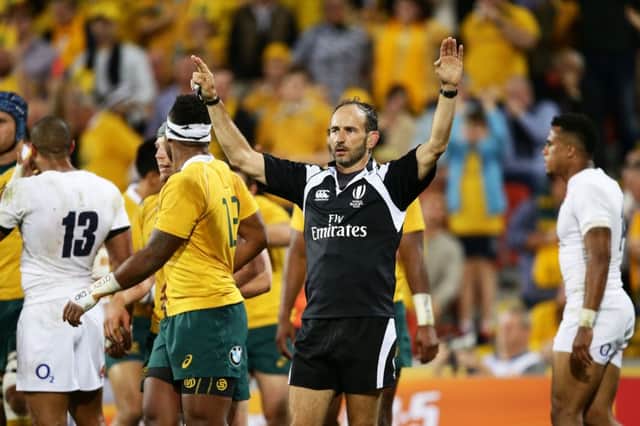 Referee Romain Poite calls for help from the television official during a Test between Australia and England. Picture: Getty