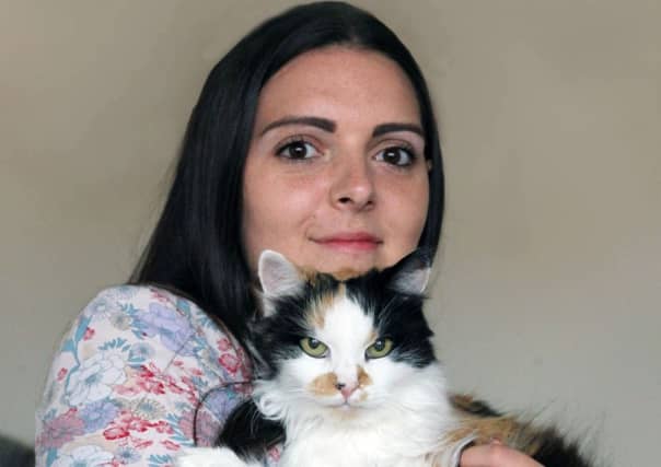 Kirsty with cat Peggy. Picture: submitted