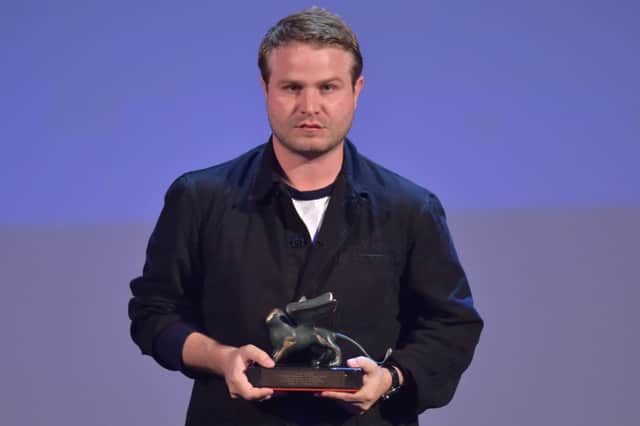 Brady Corbet holds the Orizzonti award for Best Director for his movie The Childhood of a Leader in Venice. Picture: Getty