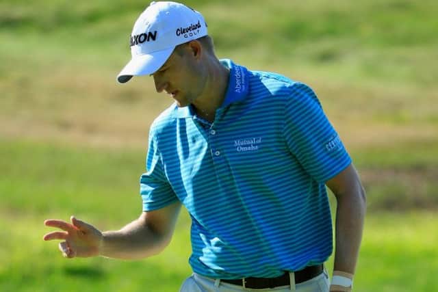 Russell Knox acknowledges the crowd on his way to a second successive 67 in the Travelers Championship. Picture: Getty Images