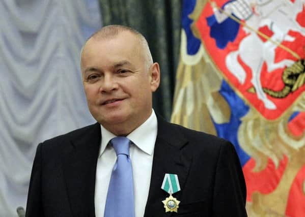 Dmitry Kiselyov (above) fronts Sputnik, which Michael Fallon calls propaganda. Photograph: Getty Images