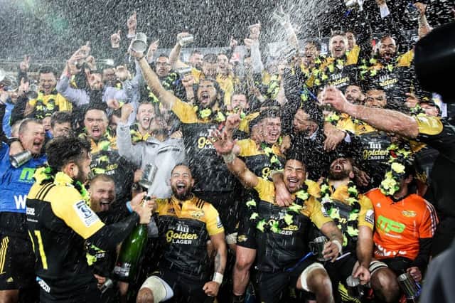 The New Zealand-based Hurricanes celebrate their first ever Super Rugby title. Photograph: Martin Hunter/AFP/Getty Images