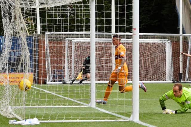 Marvin Johnson puts Motherwell 2-0 in front. Picture: Bill Murray/SNS