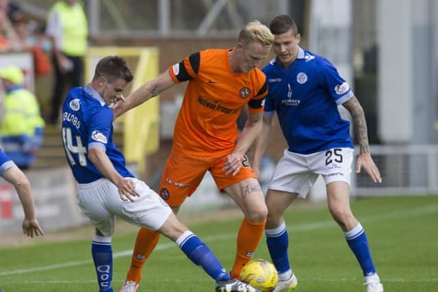 Dundee United had to rely on Nick van der Velden, centre, to rescue them a point. Pic: SNS