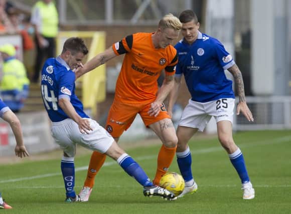 Dundee United had to rely on Nick van der Velden, centre, to rescue them a point. Pic: SNS