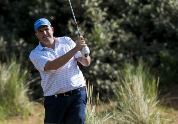Anthony Wall bear fellow Englishman Oliver Fisher at the 22nd in their semi-final at Archerfield Links. Picture: PA