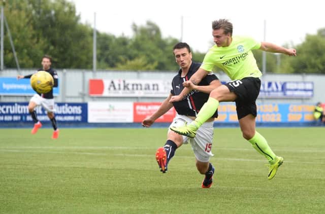 Hibs' Jason Cummings scores his side's second goal against Falkirk. Picture: Craig Foy/SNS