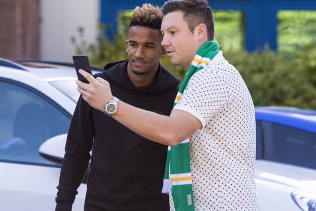 New  Celtic signing Scott Sinclair poses with a fan after undergoing a medical at Ross Hall. Picture: SNS