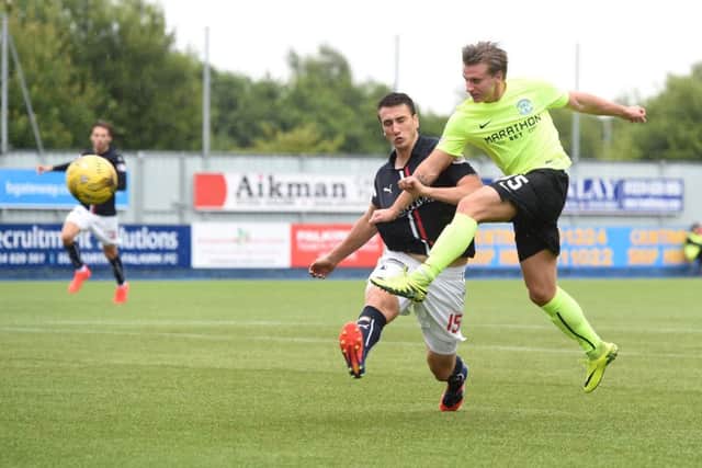 Hibernian striker Jason Cummings scores his sides second and decisive goal against Falkirk. Picture: SNS