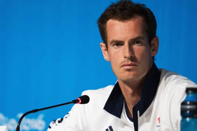 Andy Murray will play with brother Jamie in the doubles. Picture: PA