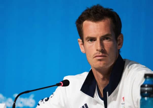 Andy Murray will play with brother Jamie in the doubles. Picture: PA