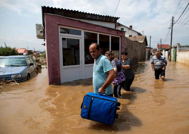 People leave their flood-hit homes in the village of Stajkovci, near Skopje.
Photo: AFP/Getty Images