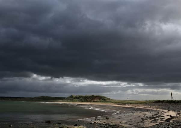 Dark clouds gather overhead at Dunnet Bay in the Highlands of Scotland. Picture: PA