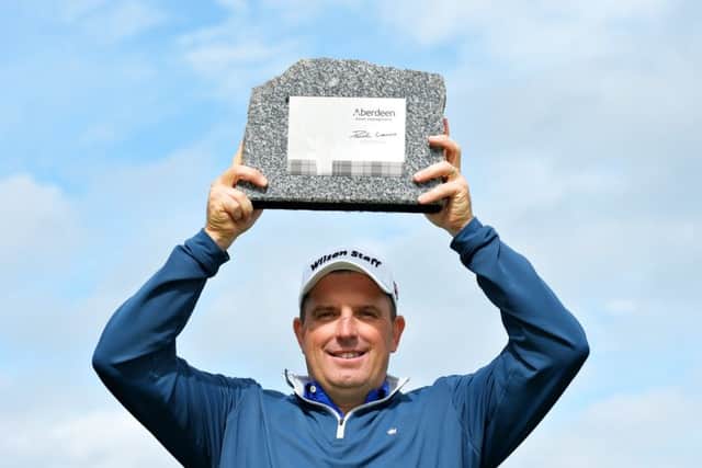 England's Anthony Wall with the trophy after winning the Aberdeen Asset Management Paul Lawrie Matchplay at Archerfield Links. Picture: Mark Runnacles/Getty