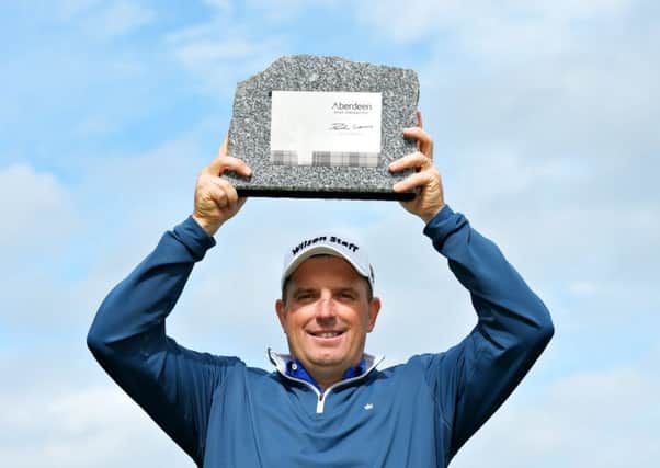 England's Anthony Wall with the trophy after winning the Aberdeen Asset Management Paul Lawrie Matchplay at Archerfield Links. Picture: Mark Runnacles/Getty