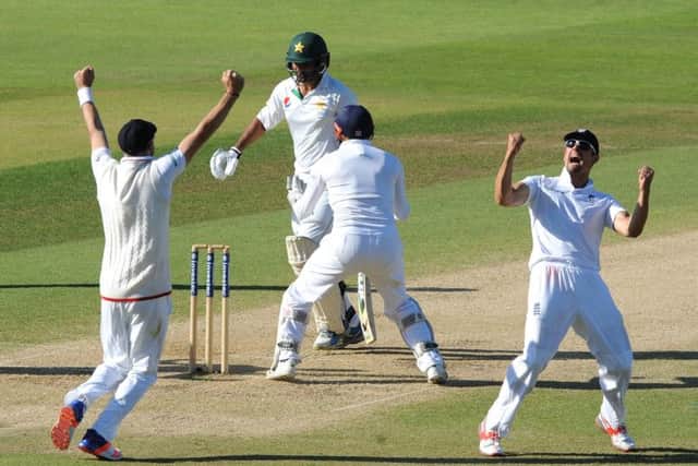 England captain Alastair Cook (right) celebrates after England beat Pakistan by 141 runs.