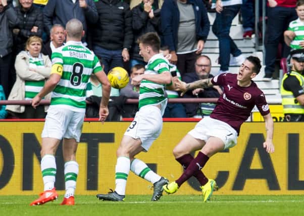 Scott Brown watches on as Jamie Walker goes to ground inside the Celtic penalty area. Picture: SNS