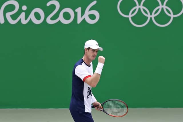 Andy Murray pumps his fist after getting off to a winning start against Serbia's Viktor Troicki. Picture: Charles Krupa/AP
