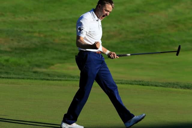Russell Knox celebrates after holing a 12-foot putt on the last hole to win the Travelers Championship in Cromwell, Connecticut. Picture: Getty Images