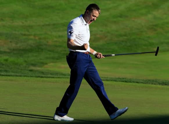 Russell Knox celebrates after holing a 12-foot putt on the last hole to win the Travelers Championship in Cromwell, Connecticut. Picture: Getty Images