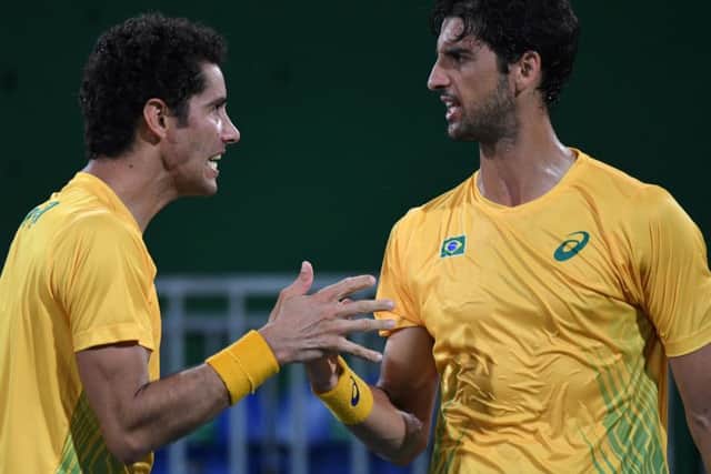 Thomaz Belluci (right) and Andre Sa celebrate after defeating Andy Murray and Jamie Murray. Picture: AFP/Getty Images