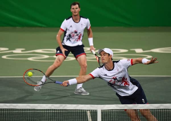 Andy Murray (right) and Jamie Murray in action against Andre Sa and Thomaz Bellucci of Brazil. Picture: AFP/Getty